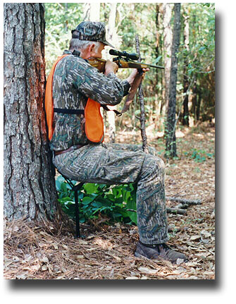 deer hunter sitting on the 16 inch seat